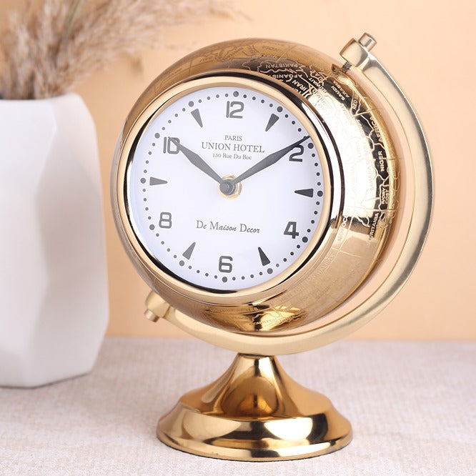 The Etched World Table Clock in gold